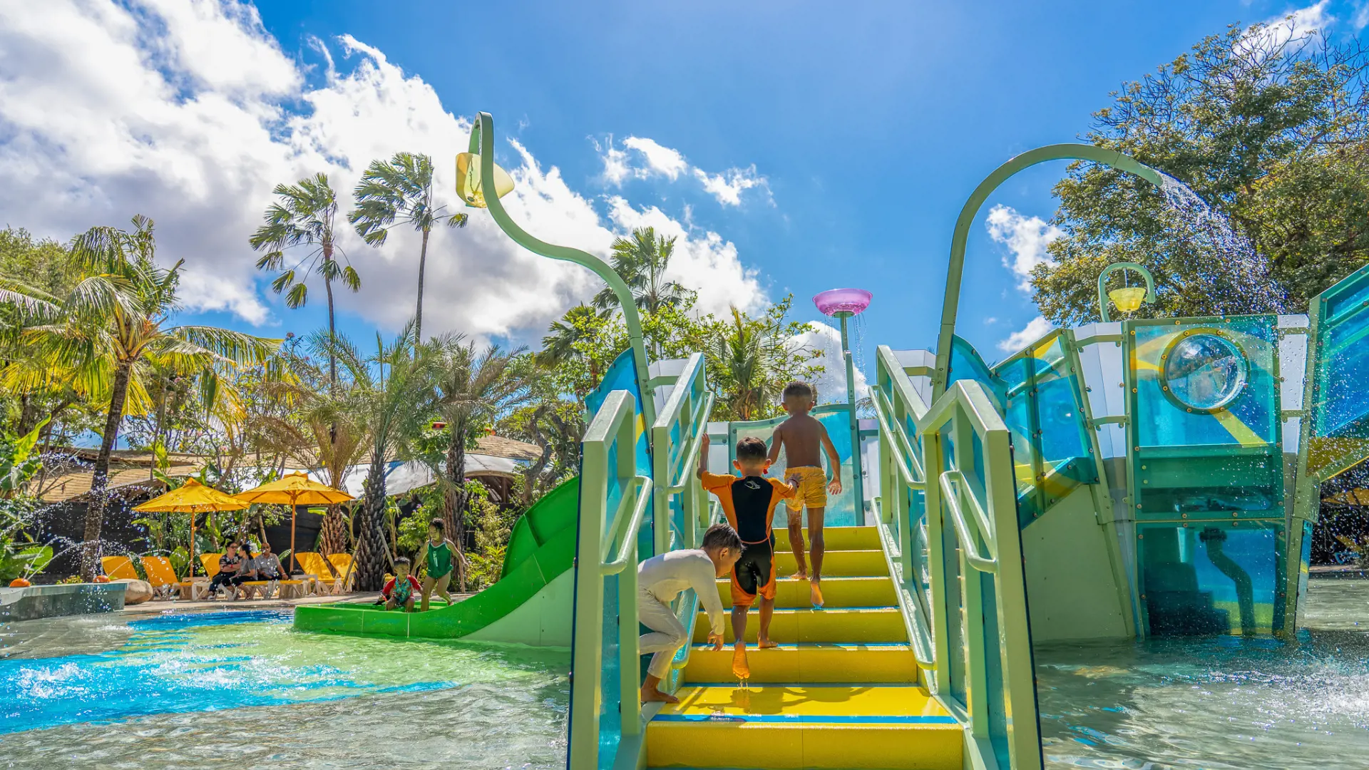 Children climbing the stairs of the AquaPlay kids water play structure at Waterbom Bali